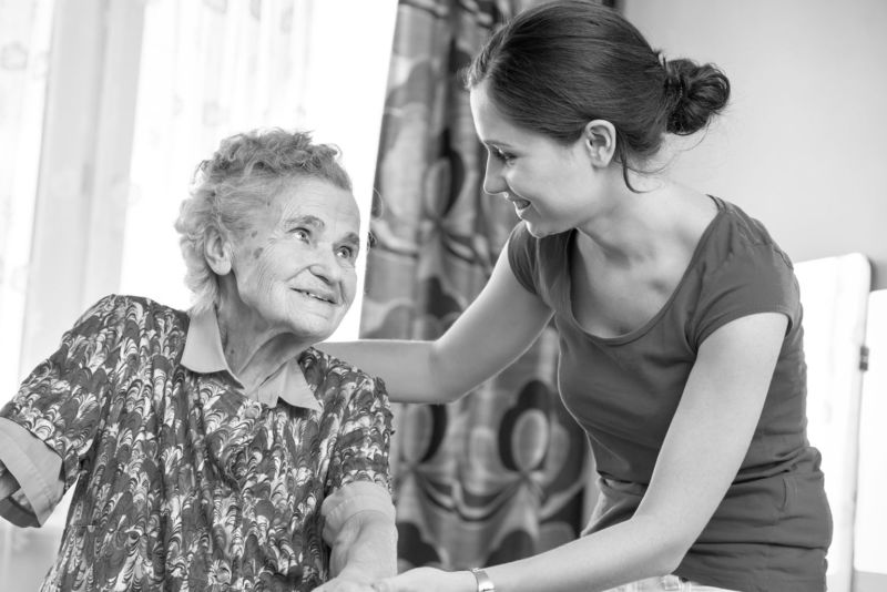  A caregiver at Three Oaks Hospice spends quality time with a patient